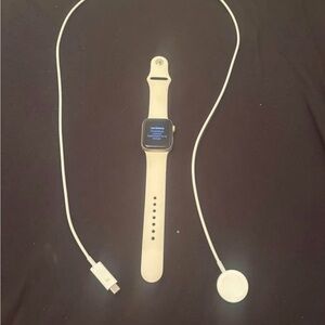 Apple Watch in White with White Sport Band and Charger. 40 MM strap